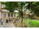 Backyard featuring a brick patio with seating, surrounded by mature trees and lush landscaping, offering a private retreat at 2350 Rosebrook Se Xing, Atlanta, GA 30339