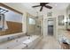 Bright bathroom featuring a large soaking tub, a glass-enclosed shower, and a vanity with double sinks at 2350 Rosebrook Se Xing, Atlanta, GA 30339