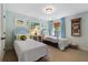Bedroom featuring two twin beds with blue headboards and light blue walls at 2350 Rosebrook Se Xing, Atlanta, GA 30339