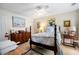 Bedroom featuring a four-poster bed with blue and white floral bedding, dresser and carpet at 2350 Rosebrook Se Xing, Atlanta, GA 30339
