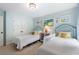 Bedroom featuring two twin beds with blue headboards and light blue walls at 2350 Rosebrook Se Xing, Atlanta, GA 30339