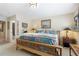 Well-lit bedroom features neutral walls, cozy decor, and wood floors, creating a relaxing atmosphere at 2350 Rosebrook Se Xing, Atlanta, GA 30339