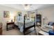 Bedroom featuring a four-poster bed with blue and white floral bedding, beige walls and carpet at 2350 Rosebrook Se Xing, Atlanta, GA 30339