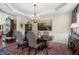 Well-appointed dining room with a chandelier, decorative rug, and seating for six at 2350 Rosebrook Se Xing, Atlanta, GA 30339