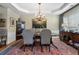 A traditional dining room showcases a wood table, upholstered chairs, and elegant decor at 2350 Rosebrook Se Xing, Atlanta, GA 30339