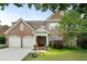 Charming brick home with a well-manicured front yard and a two-car garage in a desirable neighborhood at 2350 Rosebrook Se Xing, Atlanta, GA 30339