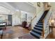 Elegant foyer with staircase, hardwood floors, and natural light at 2350 Rosebrook Se Xing, Atlanta, GA 30339