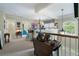 Hallway featuring a bathroom, a chandelier, table, and a window at 2350 Rosebrook Se Xing, Atlanta, GA 30339