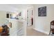 Bright upstairs hallway featuring carpet floors, white trim and doors, and space for art at 2350 Rosebrook Se Xing, Atlanta, GA 30339