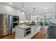 Modern kitchen features stainless steel appliances, granite countertops, and hardwood floors at 2350 Rosebrook Se Xing, Atlanta, GA 30339