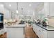 Stylish kitchen with a gas cooktop island and seamless flow to sunroom at 2350 Rosebrook Se Xing, Atlanta, GA 30339