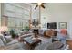 Comfortable living room with high ceilings, a fireplace, and abundant natural light, creating a welcoming atmosphere at 2350 Rosebrook Se Xing, Atlanta, GA 30339