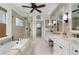 Bright main bathroom showcases dual vanities, a soaking tub, and a glass shower at 2350 Rosebrook Se Xing, Atlanta, GA 30339