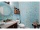 Stylish powder room with unique wallpaper and marble countertop at 2350 Rosebrook Se Xing, Atlanta, GA 30339