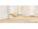 Spacious basement area with painted walls, wooden floors, and a side door leading to the outside at 468 Watson Ferry Dr, Forest Park, GA 30297
