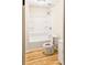 Bathroom featuring a tub with shower combo, toilet, and wood-look flooring at 468 Watson Ferry Dr, Forest Park, GA 30297