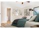 Cozy bedroom featuring a picture gallery, bedside lamp, and window allowing natural light at 468 Watson Ferry Dr, Forest Park, GA 30297