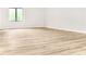 Clean bedroom with laminate wood floors and a window allowing ample natural light at 468 Watson Ferry Dr, Forest Park, GA 30297