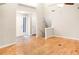 Spacious living room with hardwood floors and a view of the staircase and entrance at 468 Watson Ferry Dr, Forest Park, GA 30297