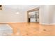 Bright living room with hardwood floors, flowing into the dining area and kitchen at 468 Watson Ferry Dr, Forest Park, GA 30297