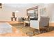Well-lit living room showcasing neutral colors and an open design with chairs and wood flooring at 468 Watson Ferry Dr, Forest Park, GA 30297