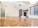 Bright living room featuring a stone fireplace, hardwood floors, and large windows at 468 Watson Ferry Dr, Forest Park, GA 30297