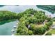Breathtaking aerial view showcasing the home nestled amidst lush trees along the serene lake shoreline at 6178 Lake Lanier Height Rd, Buford, GA 30518