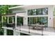 Expansive balcony with glass sliders that lead to the dining and living area, perfect for outdoor relaxation and entertainment at 6178 Lake Lanier Height Rd, Buford, GA 30518