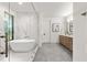 Modern bathroom featuring a freestanding tub, glass-enclosed shower, and stylish fixtures at 6178 Lake Lanier Height Rd, Buford, GA 30518
