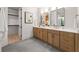 Bathroom featuring a double vanity with modern fixtures and access to a walk-in closet at 6178 Lake Lanier Height Rd, Buford, GA 30518