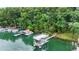 Scenic lake view featuring a modern boat dock and lift, ideal for enjoying waterfront activities at 6178 Lake Lanier Height Rd, Buford, GA 30518