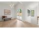 Open foyer featuring a modern light, stylish bench, and large picture window at 6178 Lake Lanier Height Rd, Buford, GA 30518