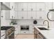 Beautiful kitchen with white cabinets, modern appliances, and a large central island at 6178 Lake Lanier Height Rd, Buford, GA 30518