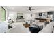 Open-concept living room with view to the kitchen featuring a large island with barstool seating at 6178 Lake Lanier Height Rd, Buford, GA 30518