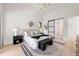 Bright bedroom featuring high ceilings, modern lighting, and a stylish accent wall at 6178 Lake Lanier Height Rd, Buford, GA 30518