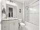 Modern bathroom with granite counters, tiled shower, and updated fixtures at 717 Lenox Ln, Atlanta, GA 30324