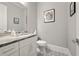 Stylish powder room with decorative floor tiles, marble countertop, and modern fixtures, creating an elegant and functional space at 717 Lenox Ln, Atlanta, GA 30324