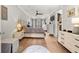 Primary bedroom with hardwood floors, a ceiling fan, and an en-suite bath at 717 Lenox Ln, Atlanta, GA 30324