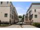Gated community featuring modern townhomes with brick and stucco exteriors at 717 Lenox Ln, Atlanta, GA 30324
