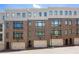Modern townhome with brick facade, multiple windows, and attached garage at 717 Lenox Ln, Atlanta, GA 30324