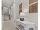 Elegant entry hall with stylish console table, patterned floors, and staircase access at 717 Lenox Ln, Atlanta, GA 30324