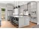 Modern kitchen features a large island, shaker cabinets, and stainless steel appliances at 717 Lenox Ln, Atlanta, GA 30324