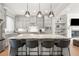 Large kitchen with island seating, shaker cabinets, and stainless steel appliances at 717 Lenox Ln, Atlanta, GA 30324