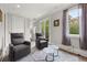 Bright sitting room featuring hardwood floors, neutral decor, and abundant natural light at 717 Lenox Ln, Atlanta, GA 30324