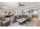 Open living room showcases modern decor, gray sofa, hardwood floors, and plenty of natural light at 717 Lenox Ln, Atlanta, GA 30324