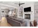 Cozy living room features a fireplace, mounted TV, and integrated shelving at 717 Lenox Ln, Atlanta, GA 30324