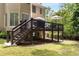 Elevated deck overlooking the backyard with stairs leading down to the lawn at 820 Chelsea Park Ne Dr, Marietta, GA 30068