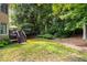 Well-maintained backyard with lush greenery and a deck at 820 Chelsea Park Ne Dr, Marietta, GA 30068