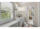 Charming bathroom featuring natural light, a comfortable window seat, and stylish vanity at 820 Chelsea Park Ne Dr, Marietta, GA 30068