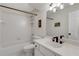Clean bathroom with a combined shower and tub, and a white vanity with black fixtures at 820 Chelsea Park Ne Dr, Marietta, GA 30068